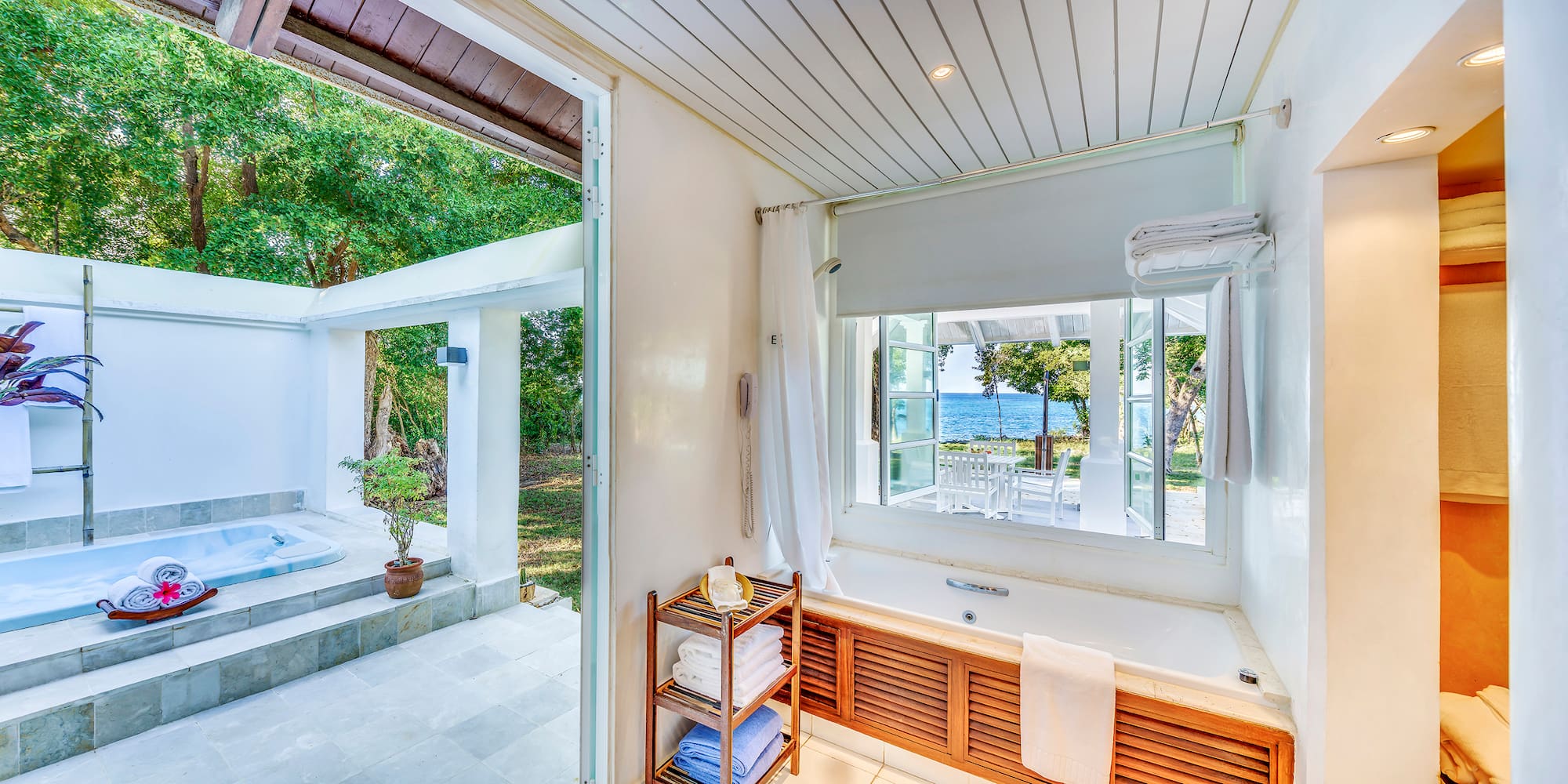 a bathroom with a bathtub and a window