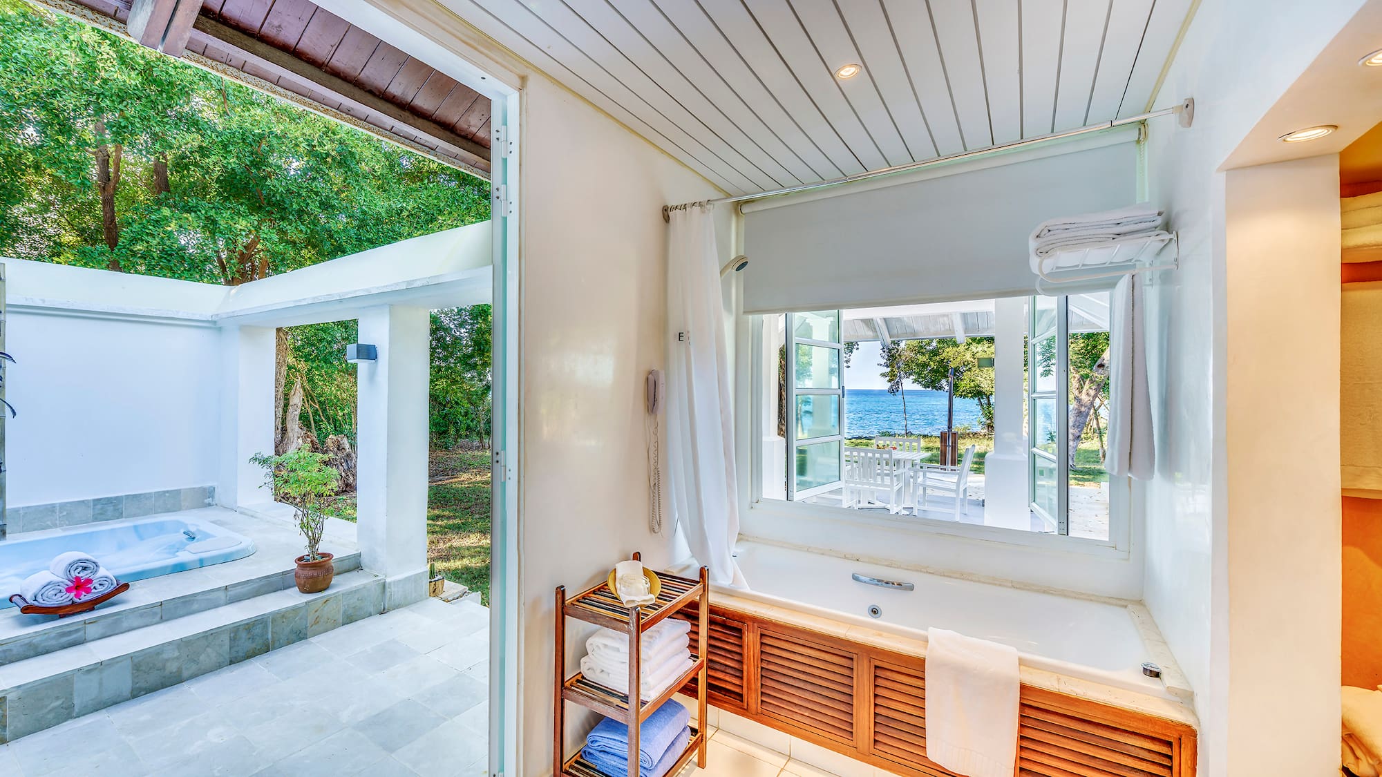 a bathroom with a bathtub and a window