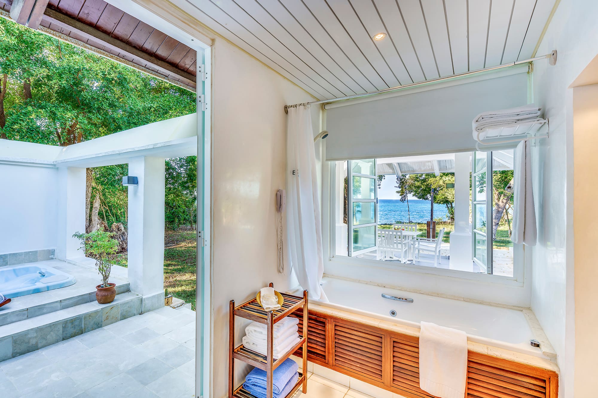 a bathroom with a bathtub and a window