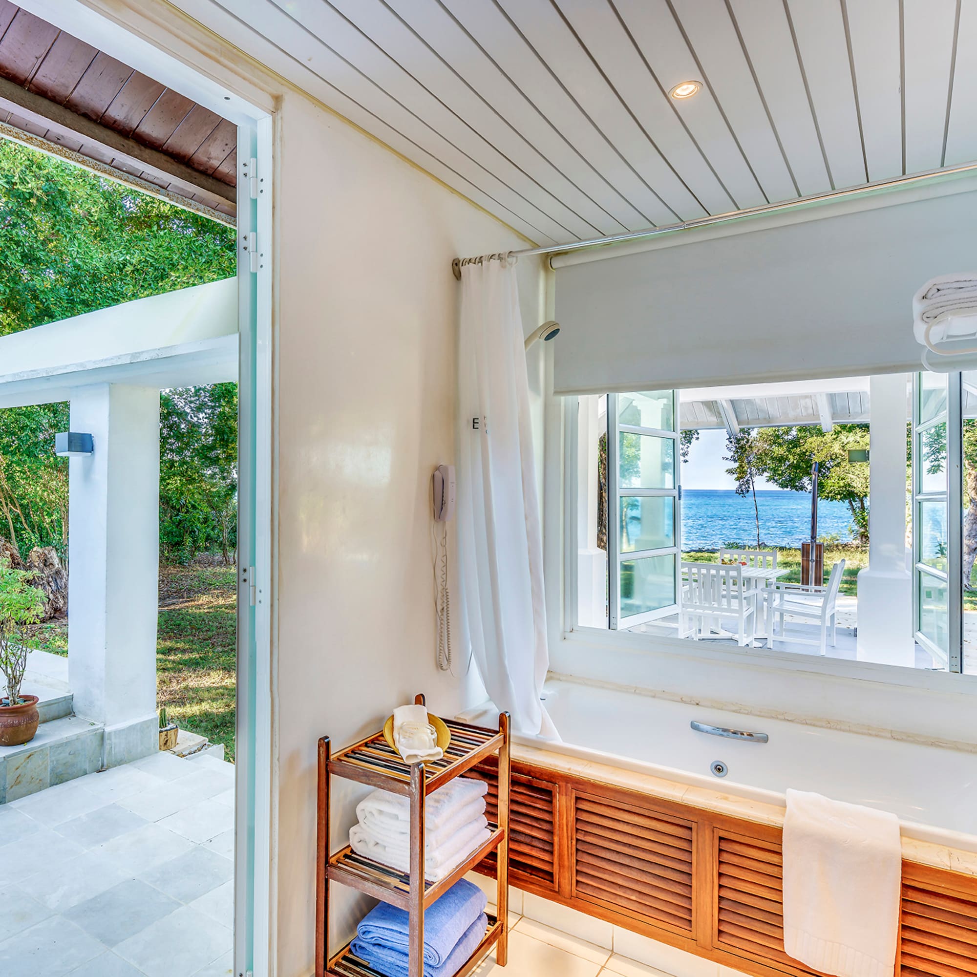 a bathroom with a bathtub and a window