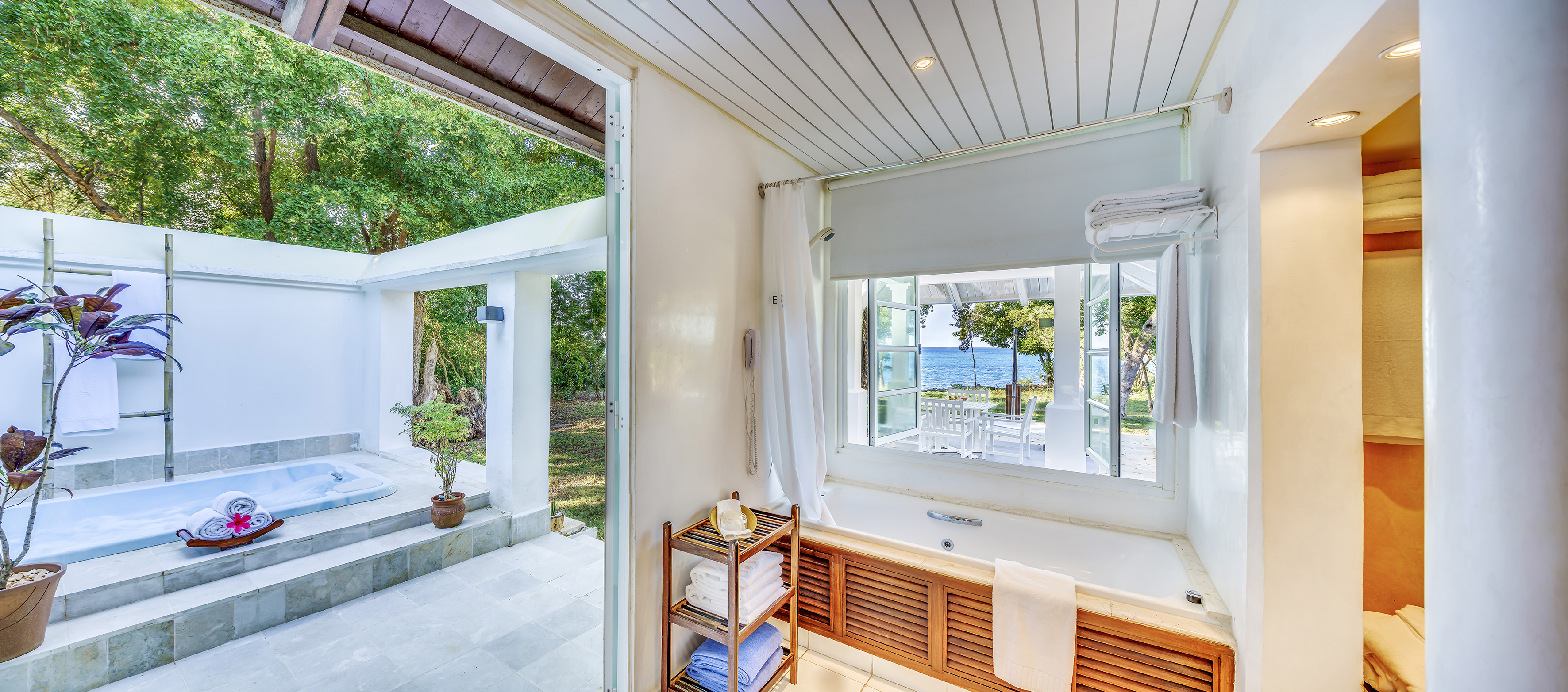 a bathroom with a bathtub and a window