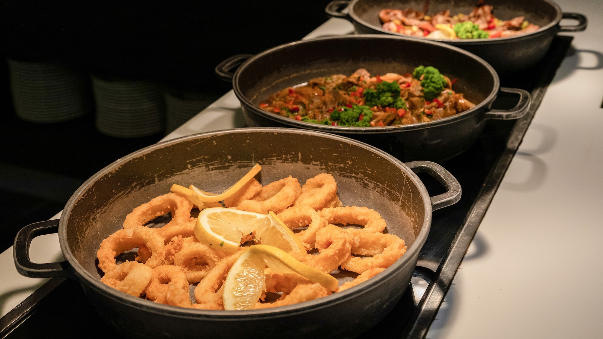 a group of pans with food in them