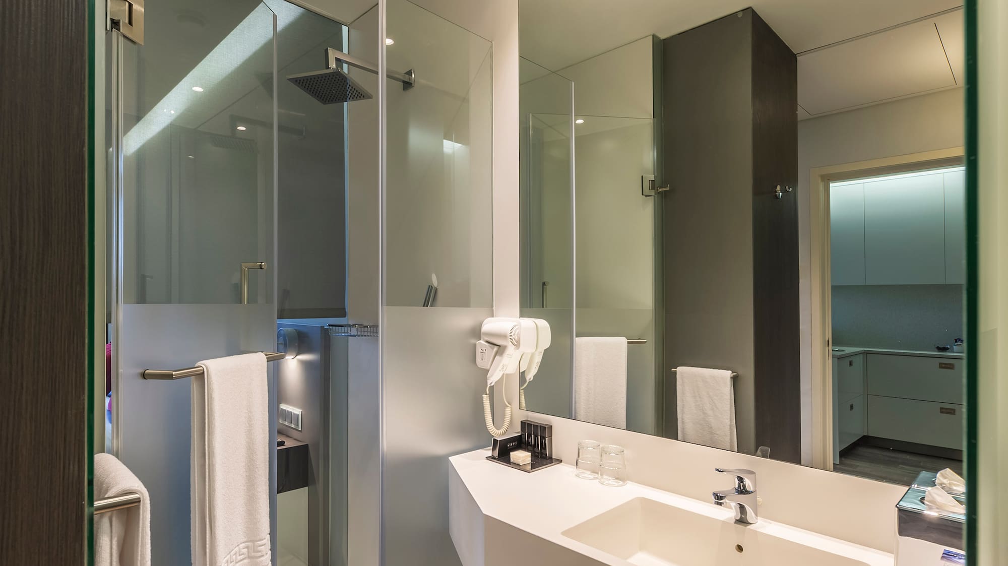 a bathroom with a shower and sink