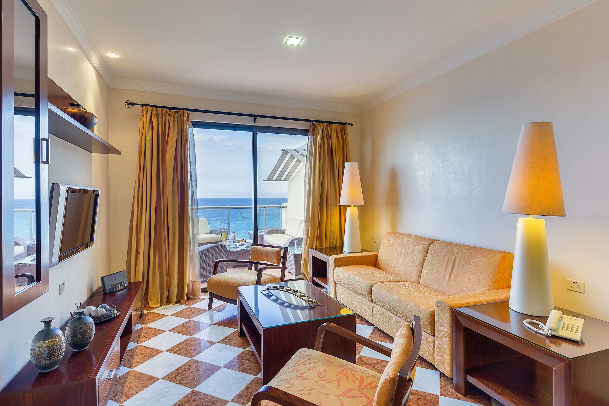 a room with a couch and a table and chairs