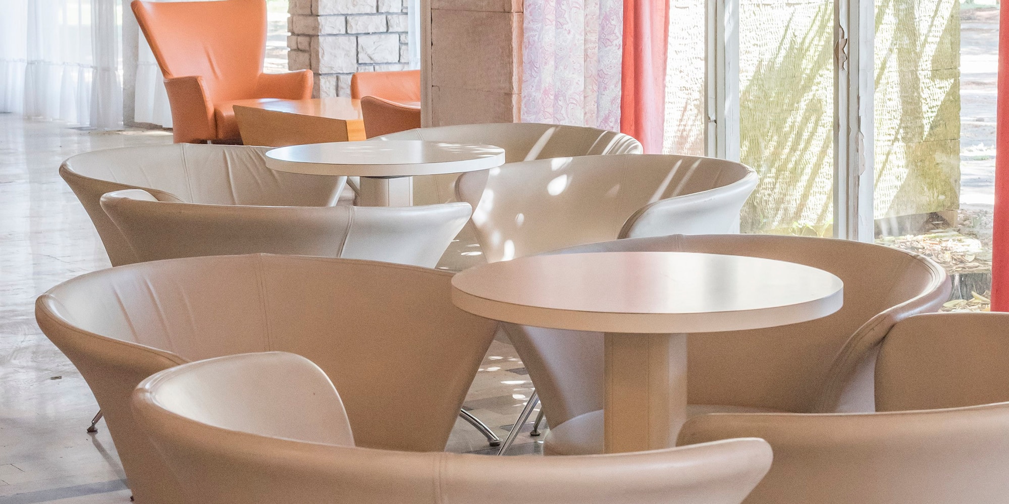 a group of tables and chairs in a room