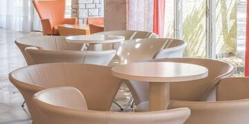 a group of tables and chairs in a room