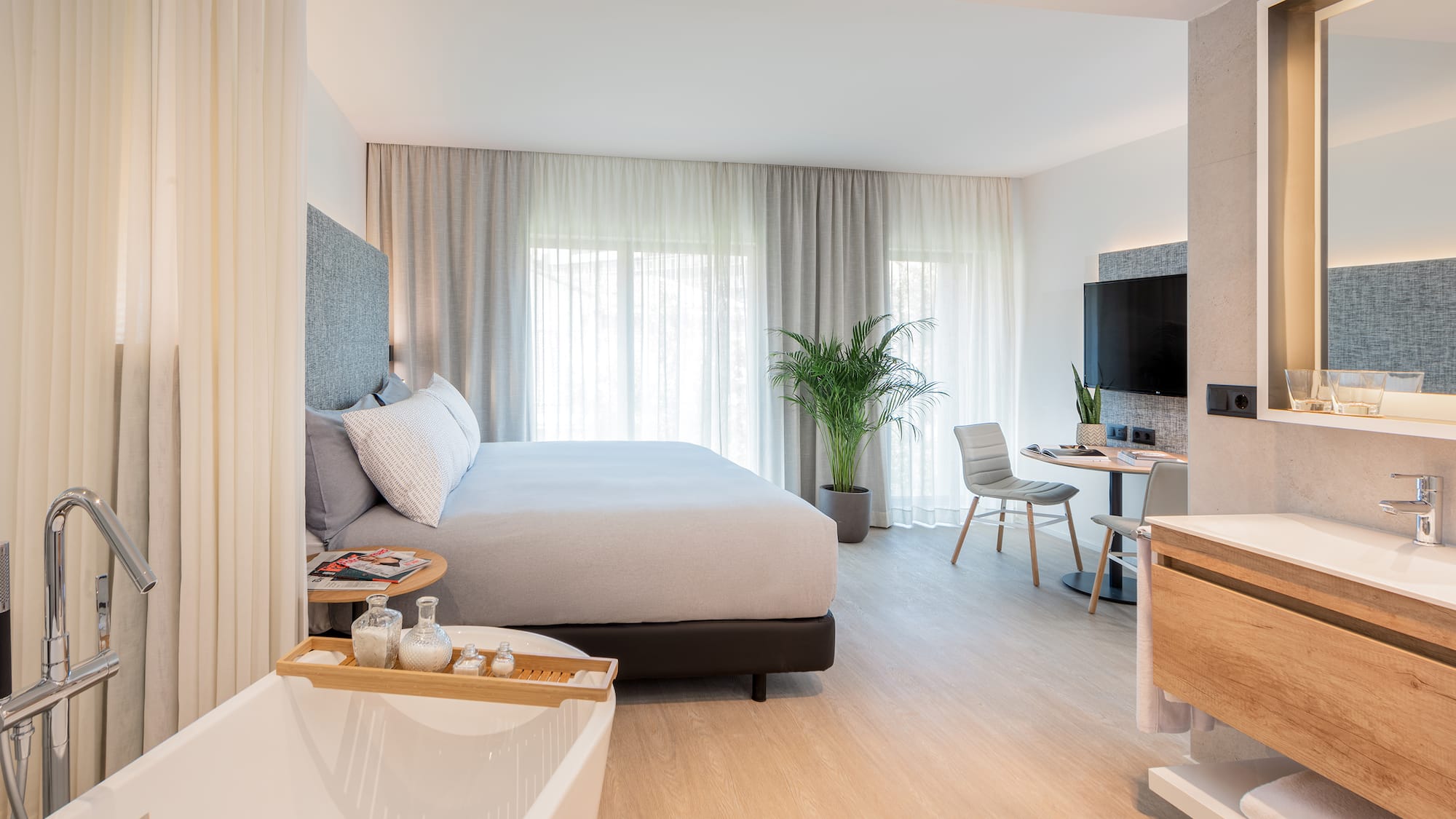 a bedroom with a bed and a bathtub