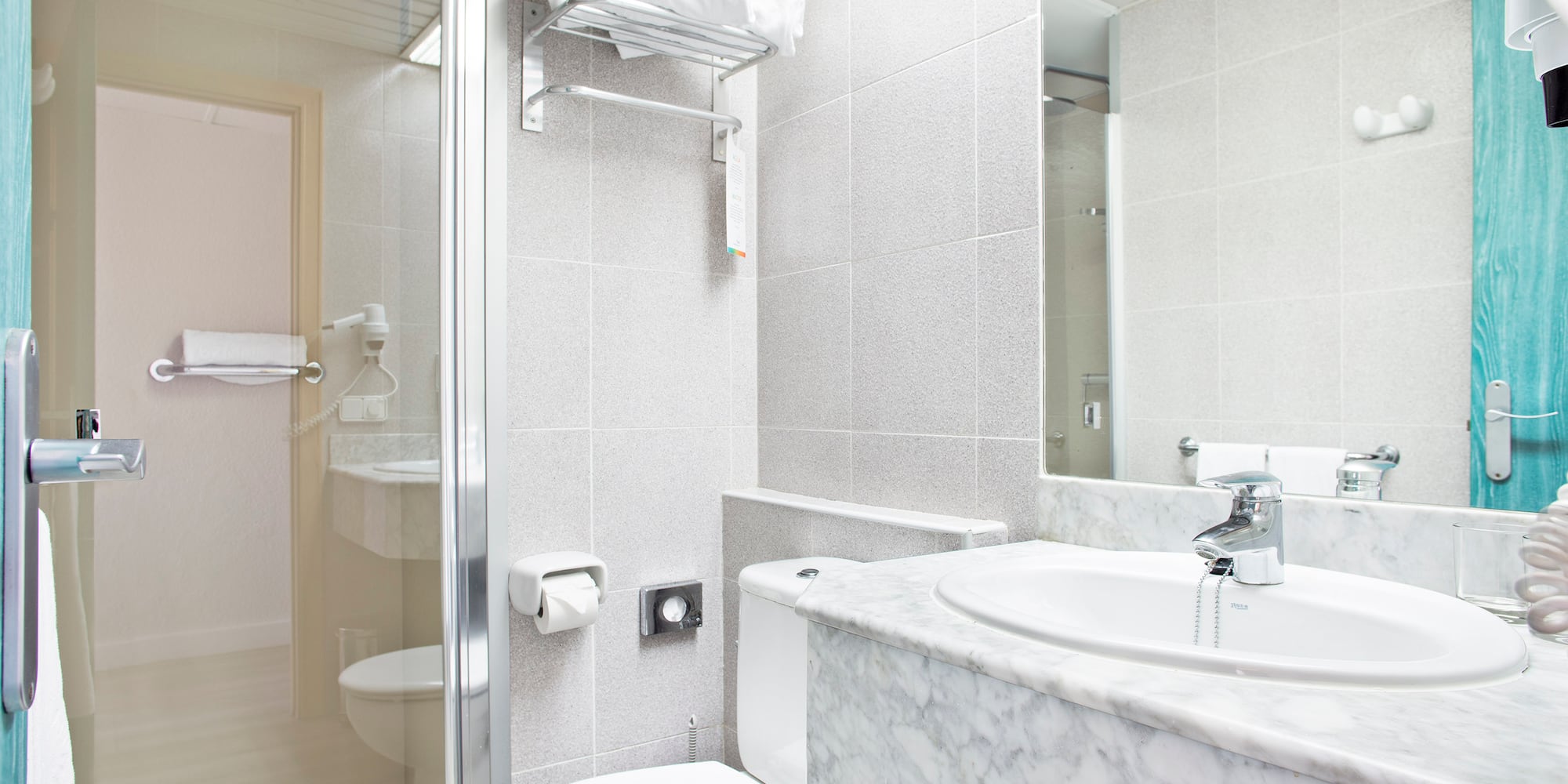a bathroom with a marble countertop and sink