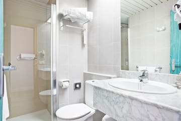 a bathroom with a marble countertop and sink
