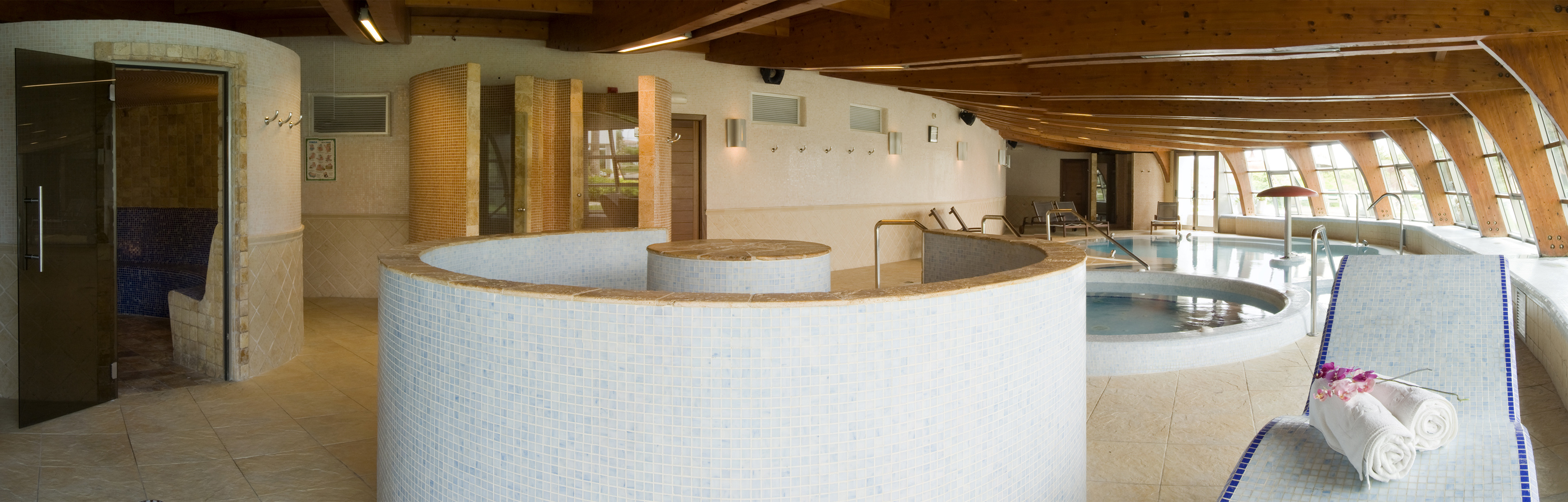 a room with a round pool