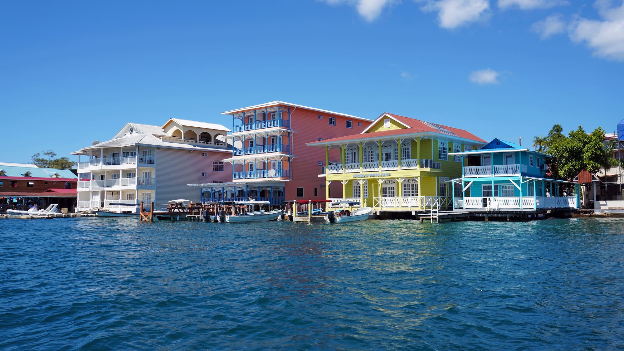 a group of colorful houses on water