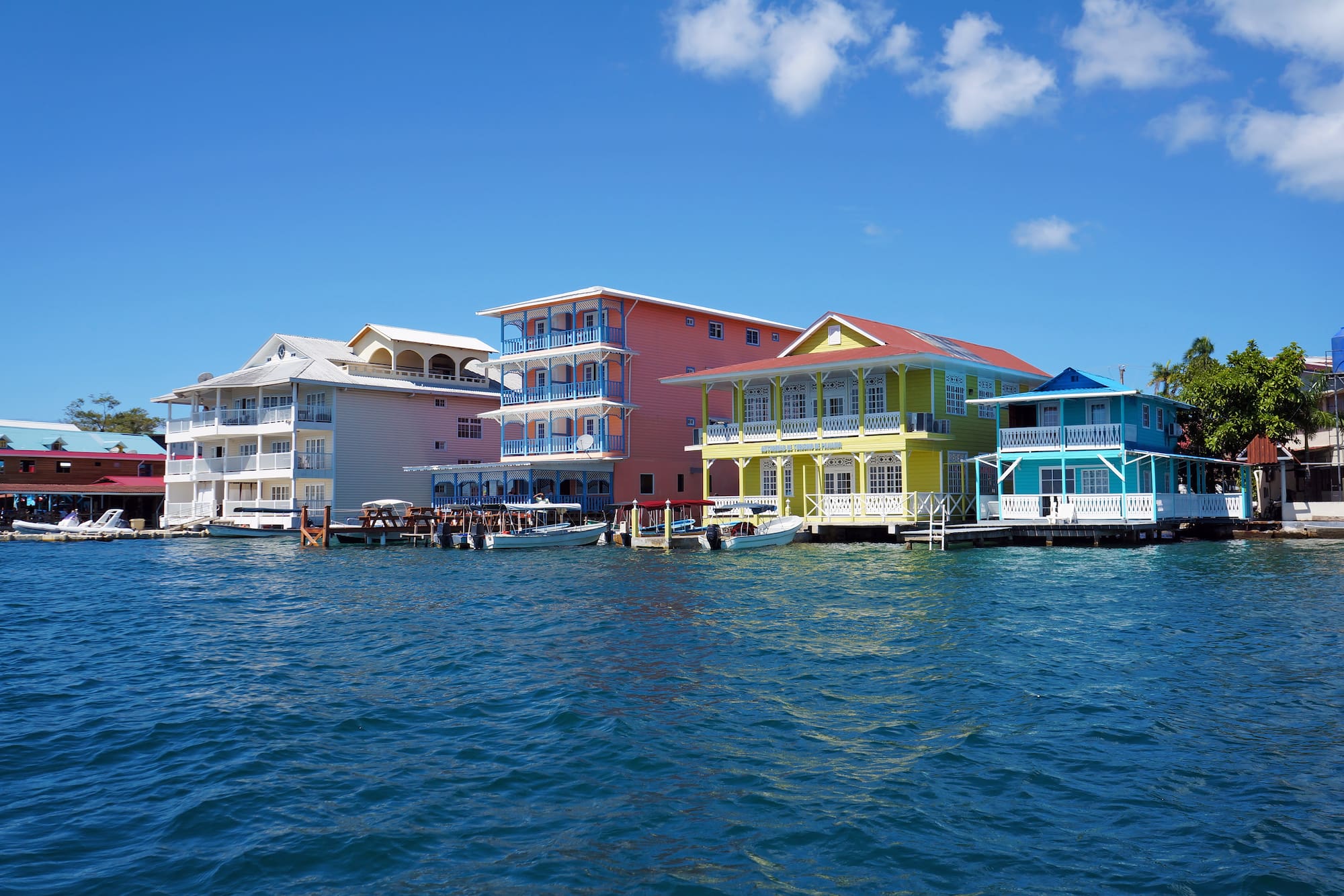 a group of colorful houses on water