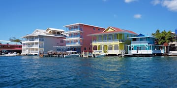 a group of colorful houses on water