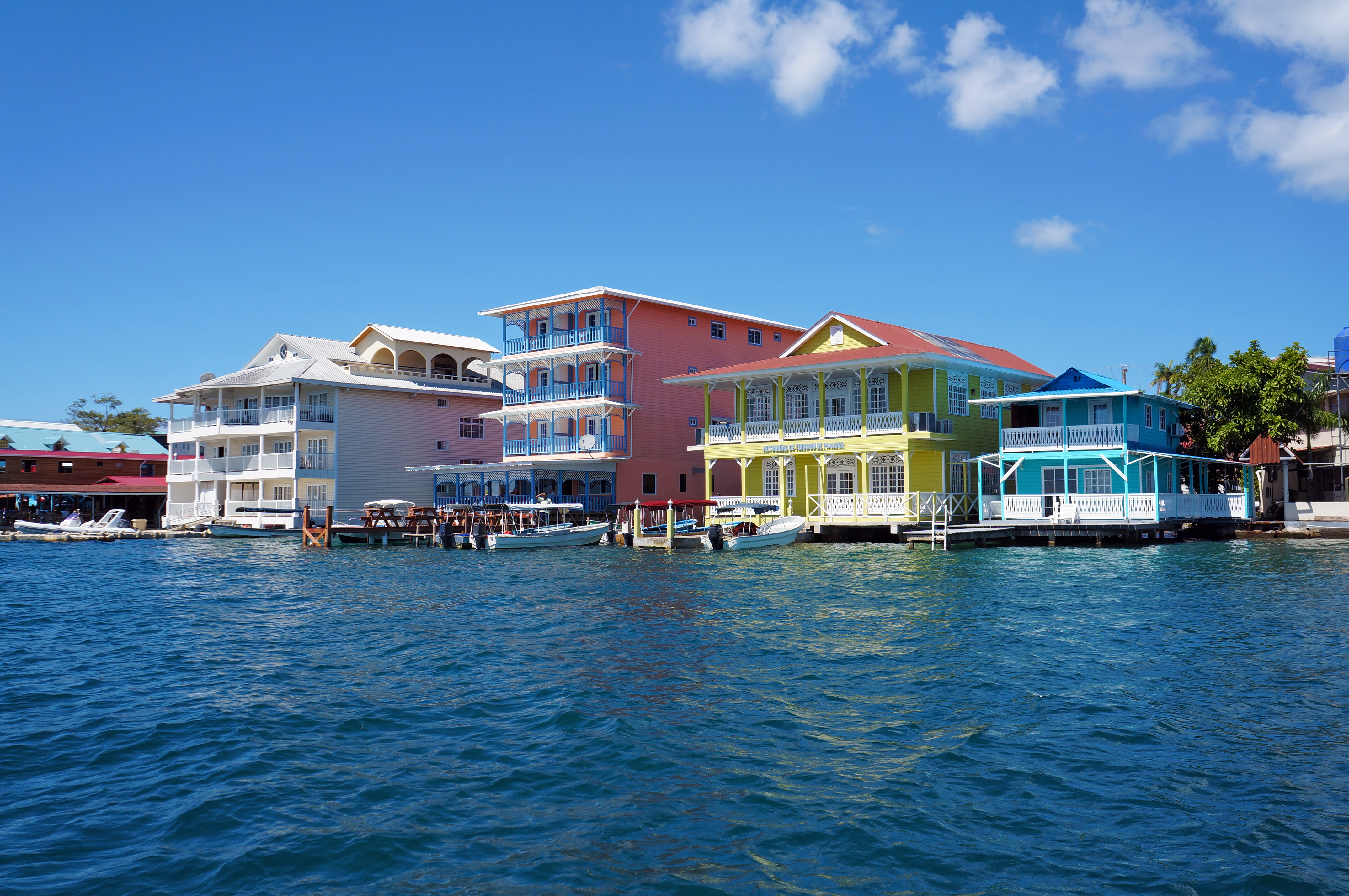 a group of colorful houses on water