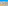 Colorful coastal town with white buildings, palm trees, sandy beach, and blue ocean.