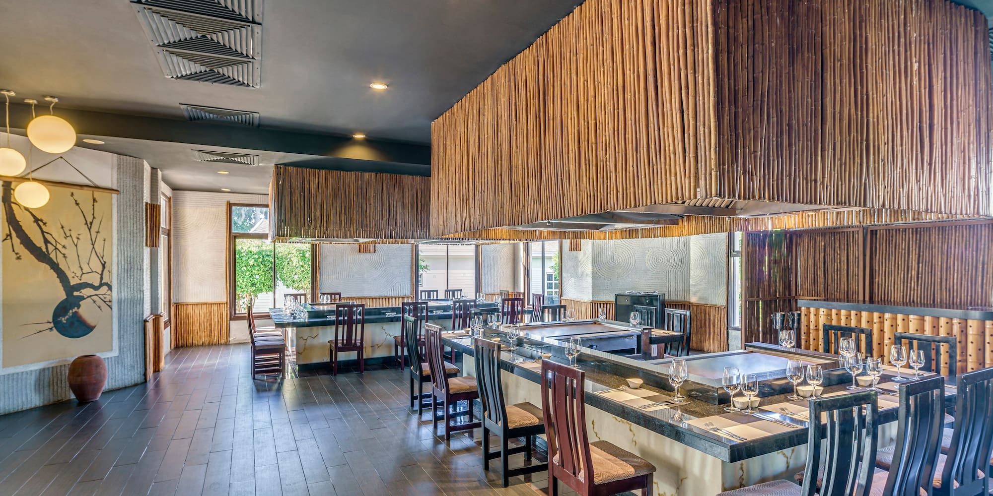 a large room with a large counter and chairs