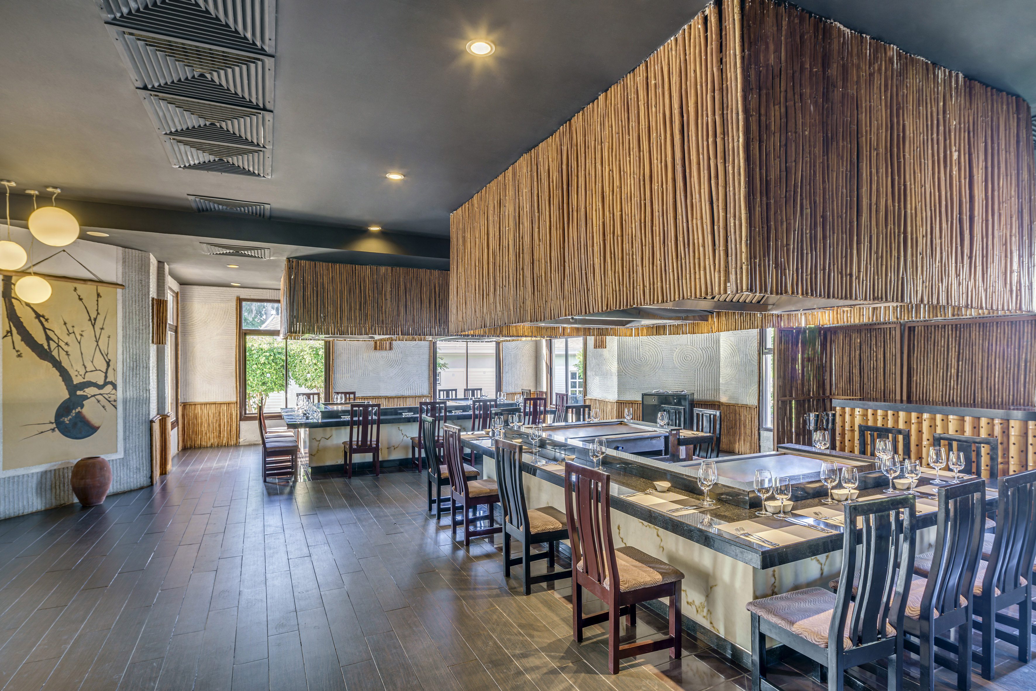 a large room with a large counter and chairs