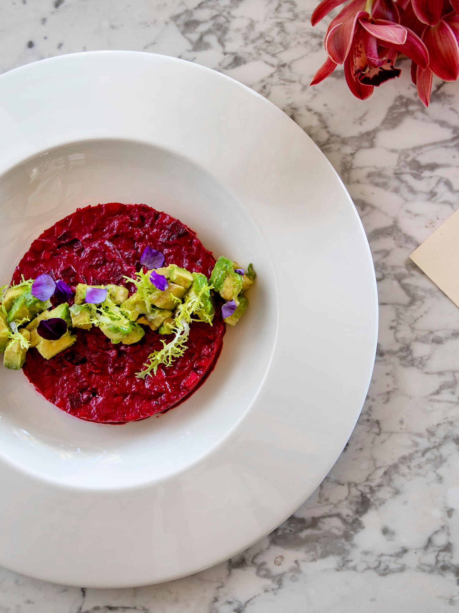 a plate of food on a marble table