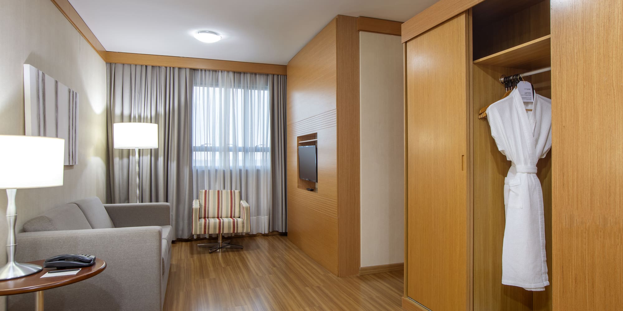 a room with a white robe and a couch