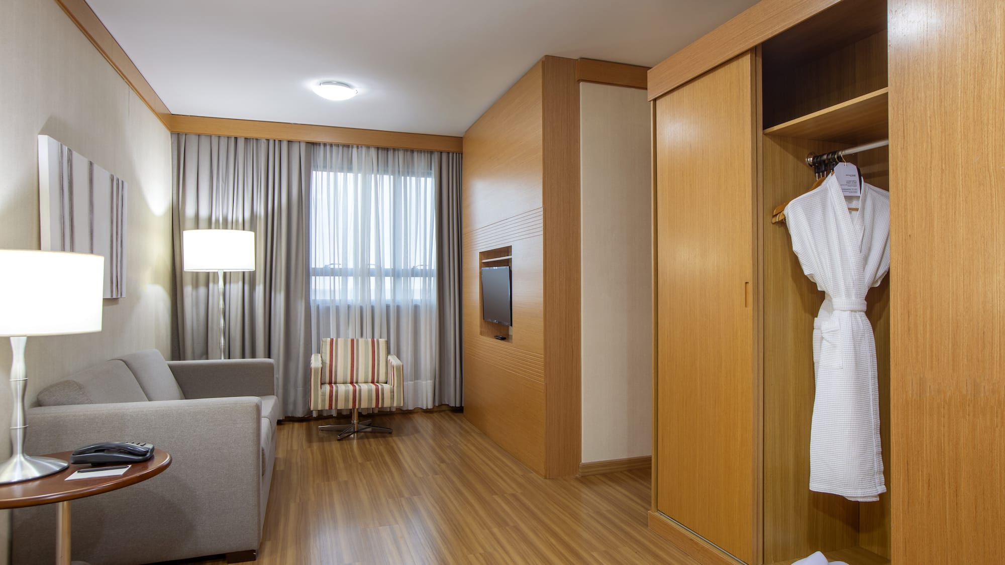 a room with a white robe and a couch