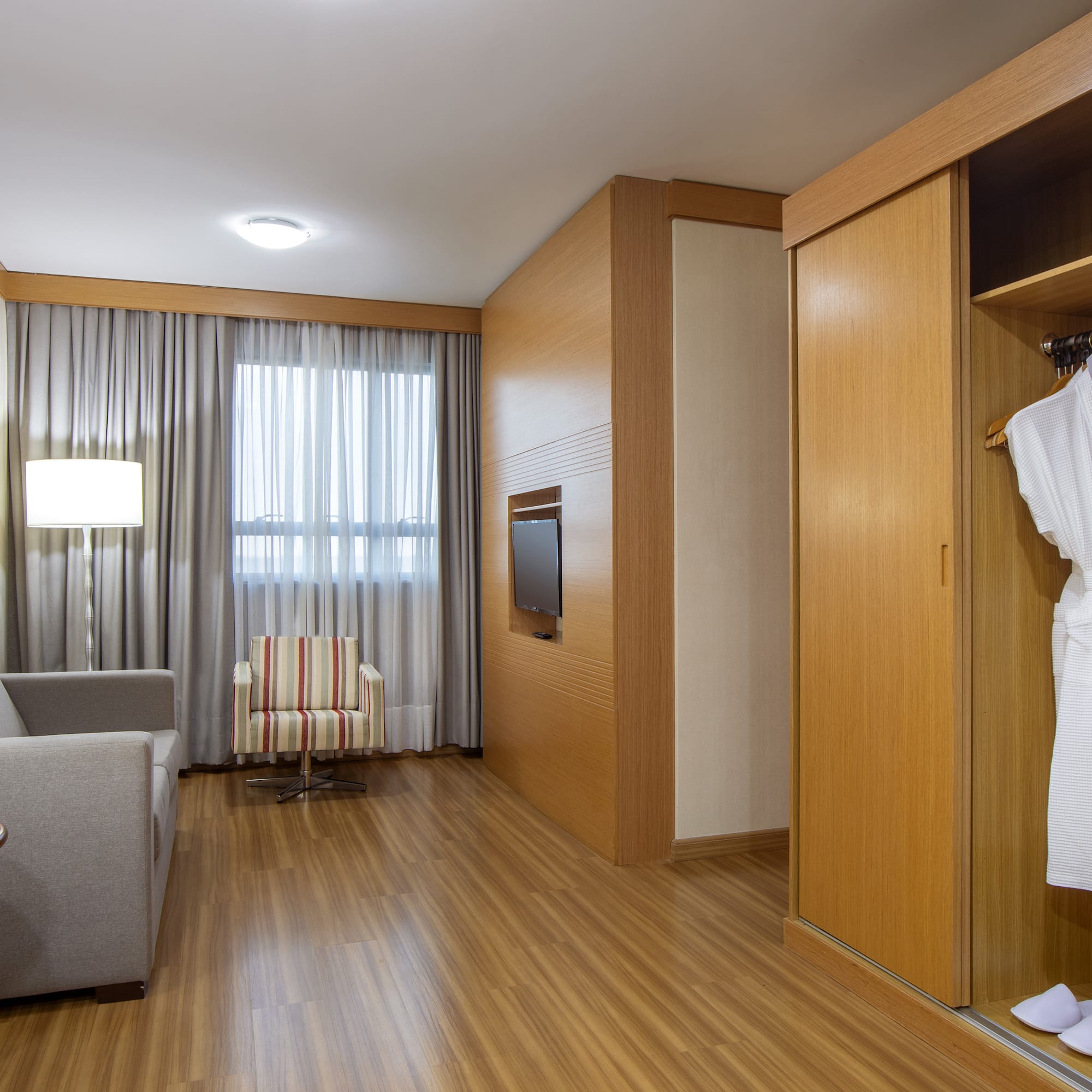 a room with a white robe and a couch