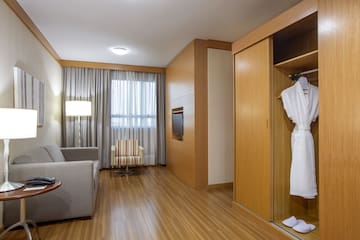 a room with a white robe and a couch