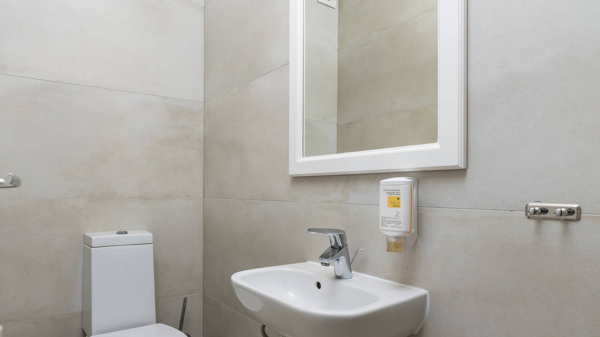 a bathroom with a sink and toilet