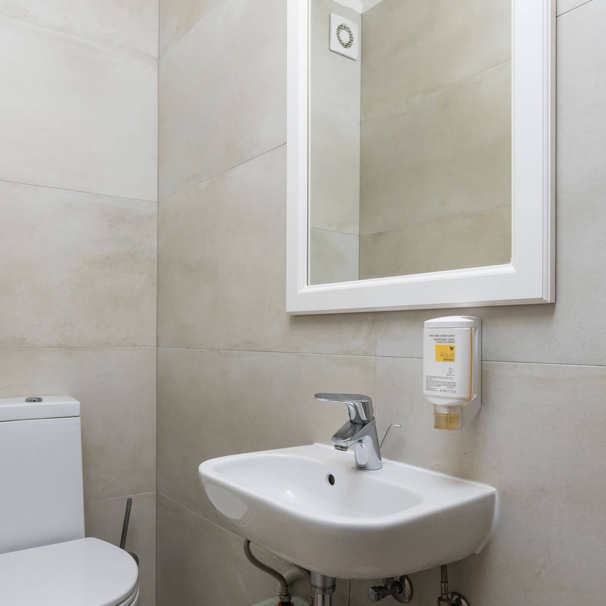 a bathroom with a sink and toilet