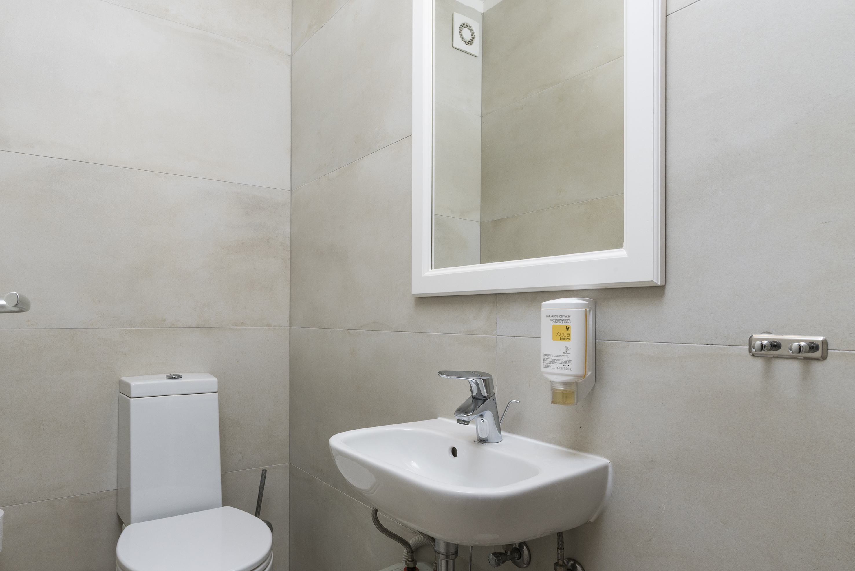 a bathroom with a sink and toilet