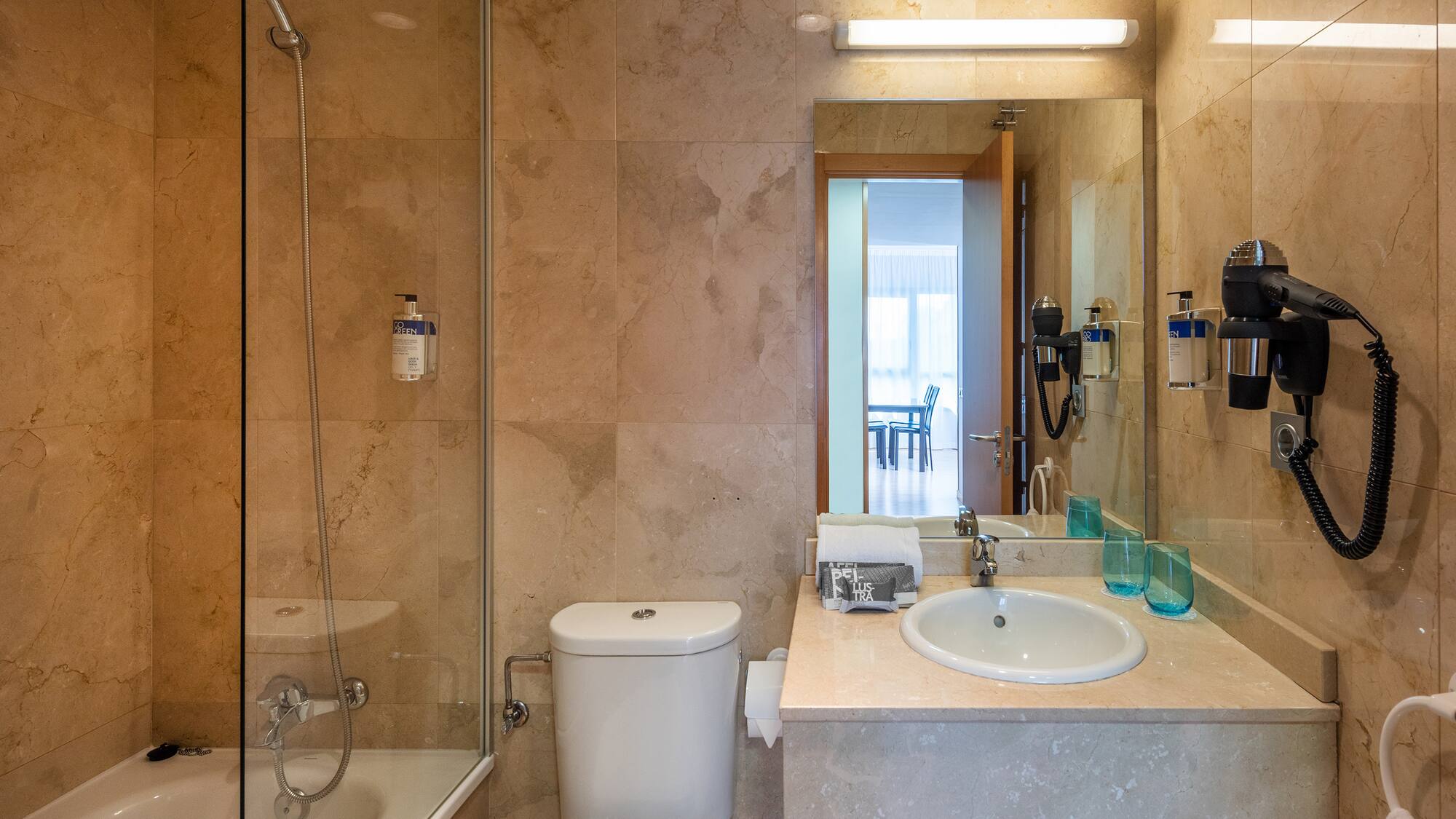 a bathroom with a shower and sink