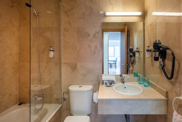 a bathroom with a shower and sink