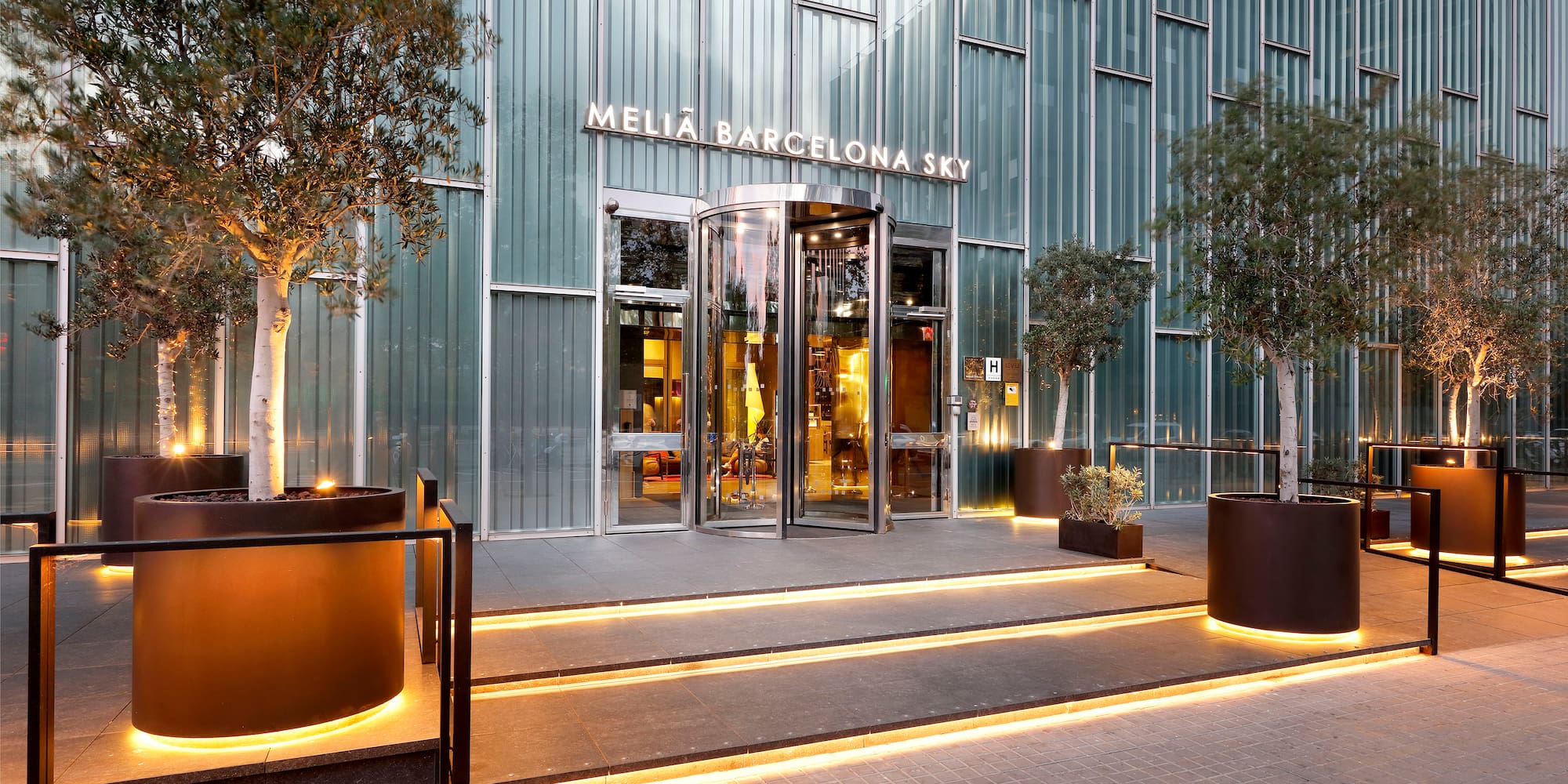 a building with glass doors and stairs