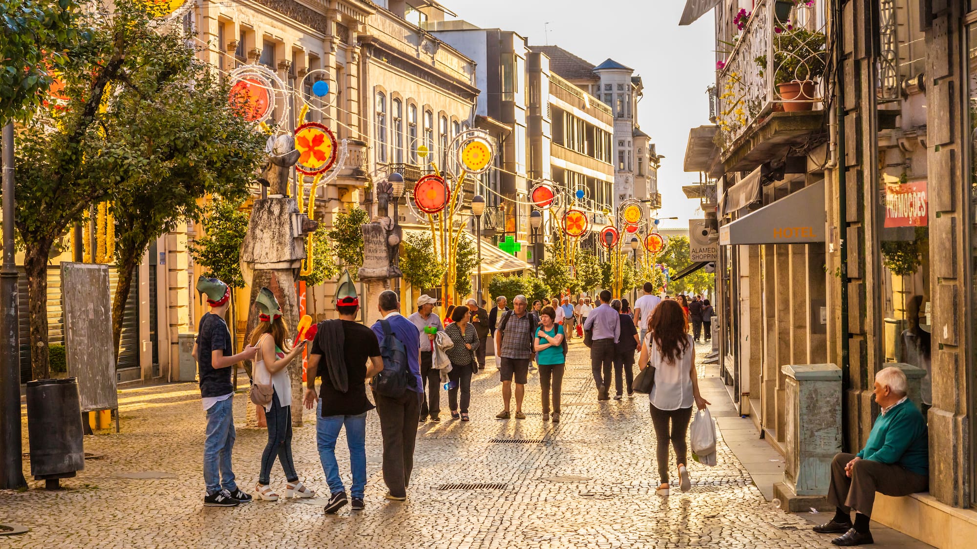 a group of people walking on a street