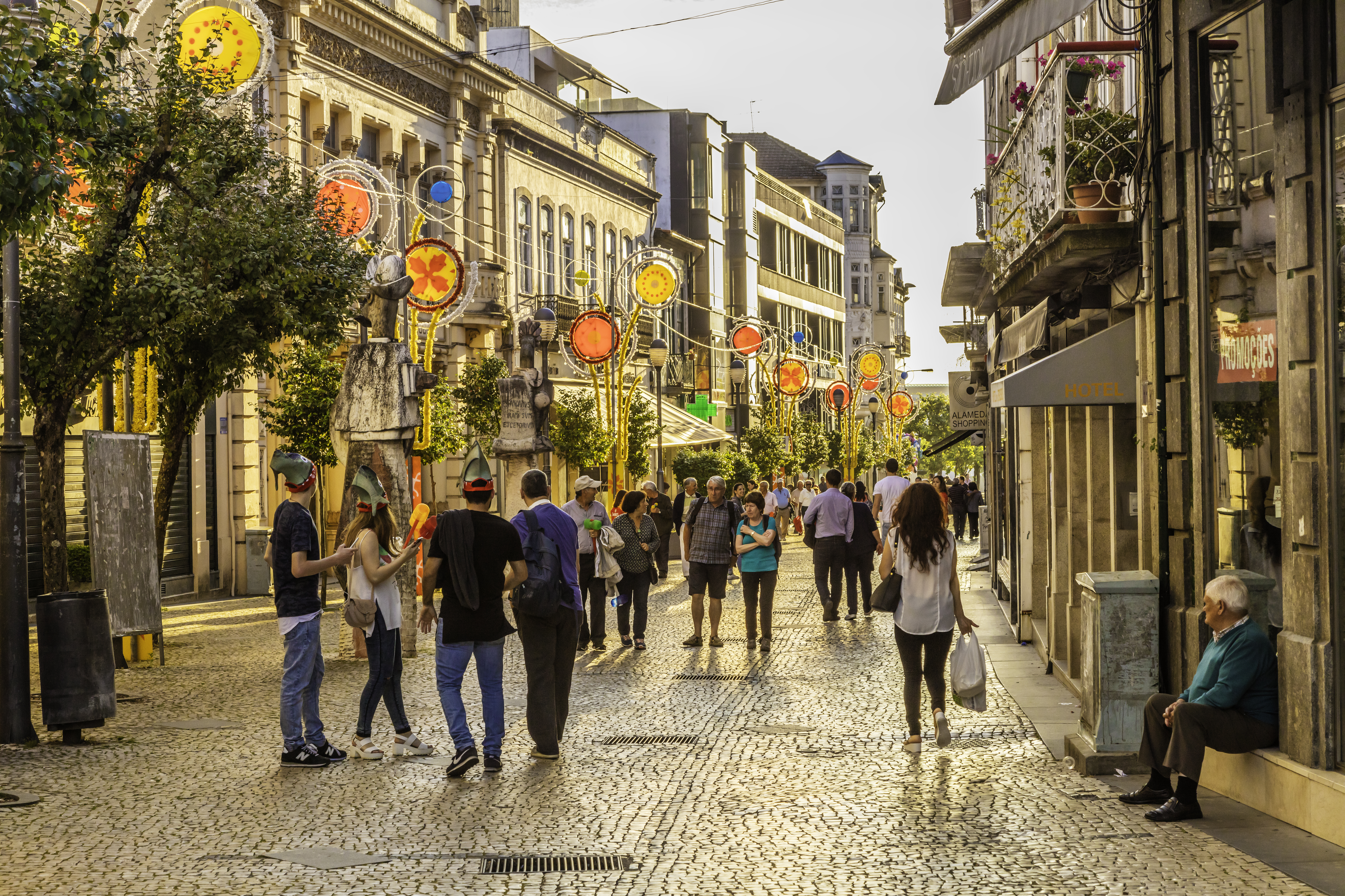 a group of people walking on a street