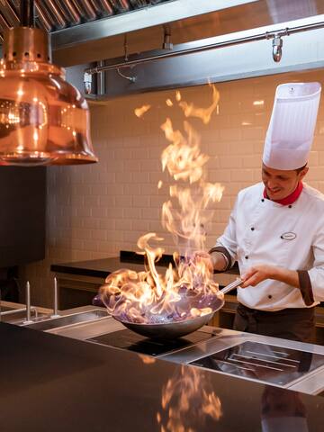 a chef cooking in a kitchen
