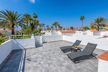 a deck chairs on a rooftop