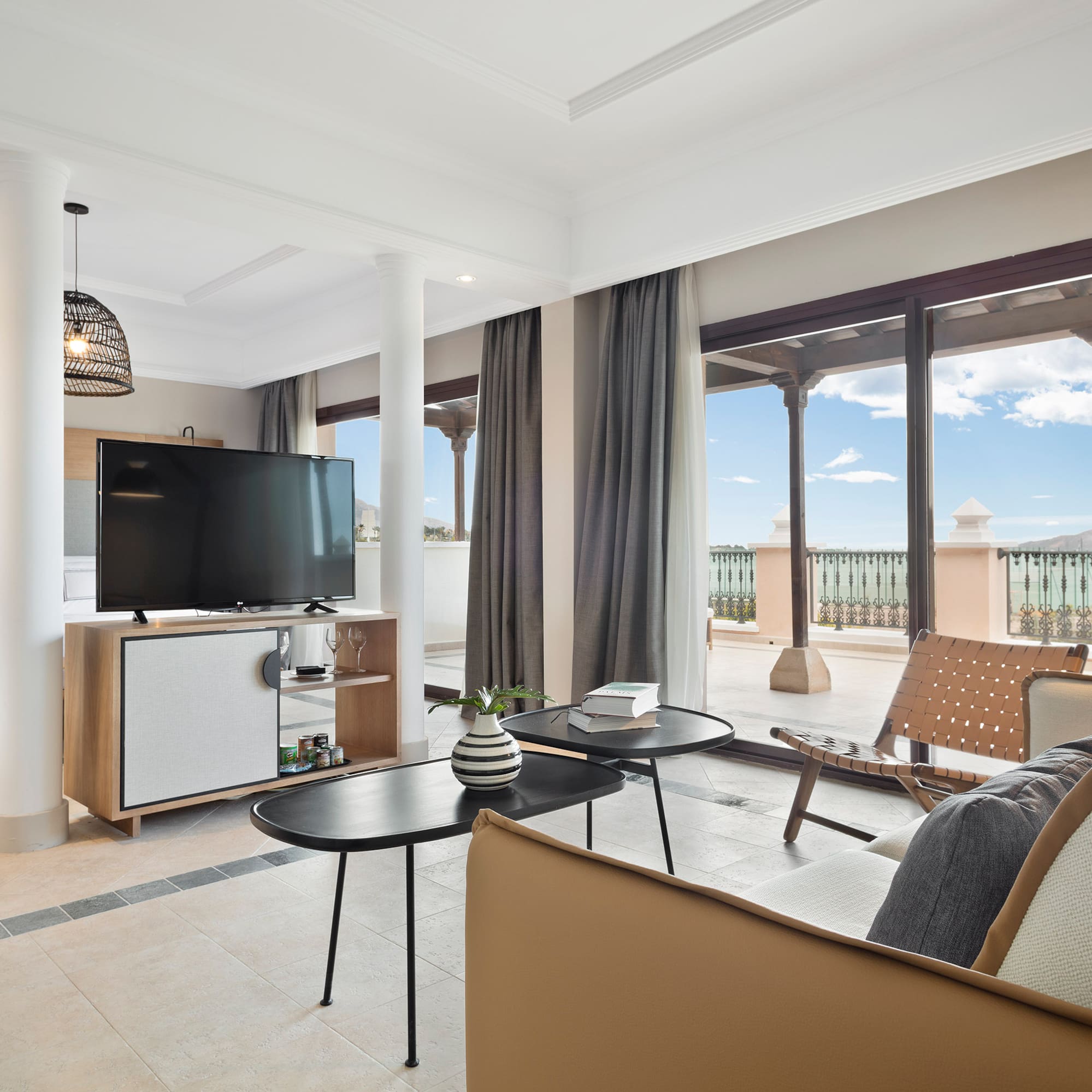a living room with a television and a patio