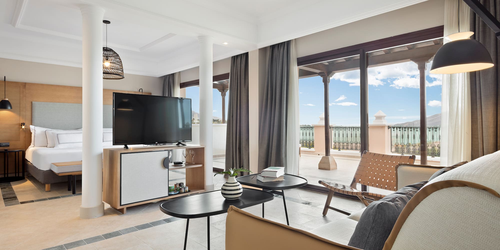 a living room with a television and a patio