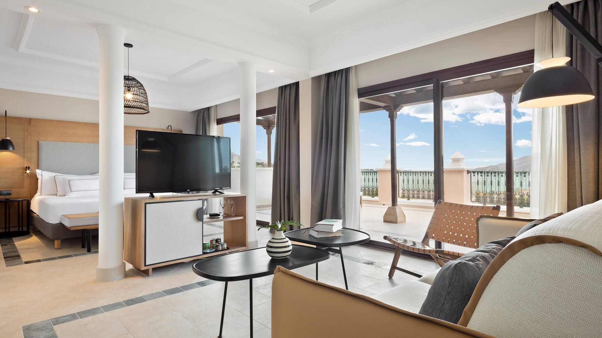 a living room with a television and a patio