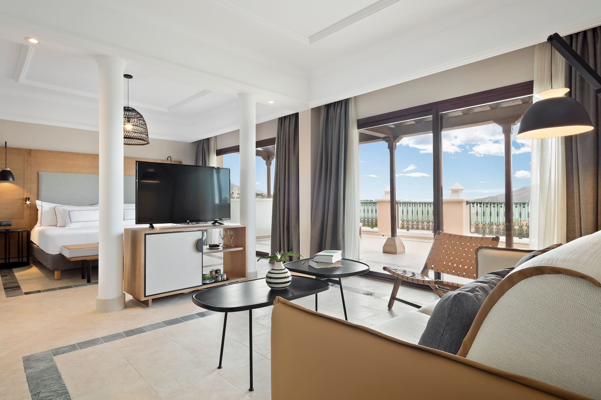 a living room with a television and a patio