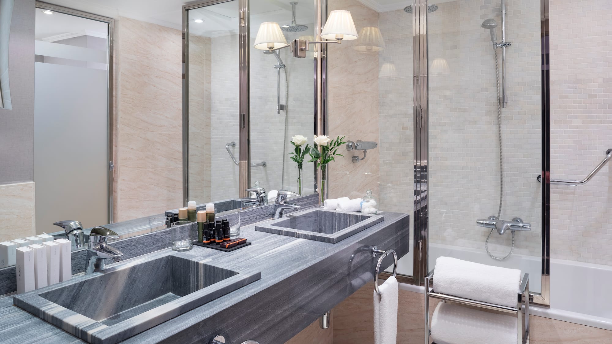 a bathroom with a shower and sink