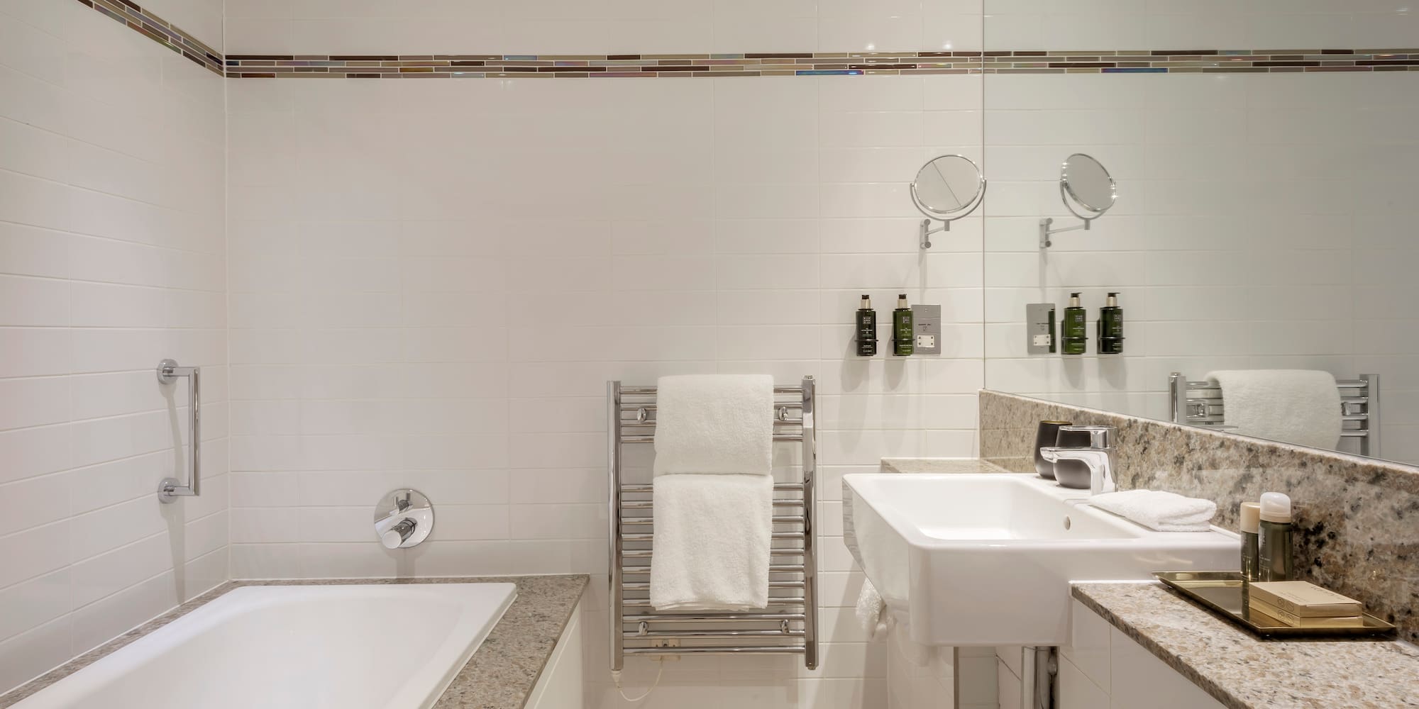 a bathroom with a bathtub and sink