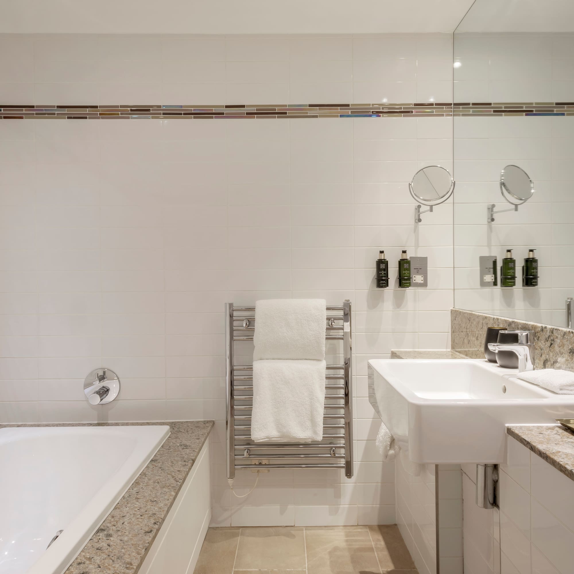 a bathroom with a bathtub and sink