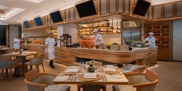 a group of chefs working in a restaurant