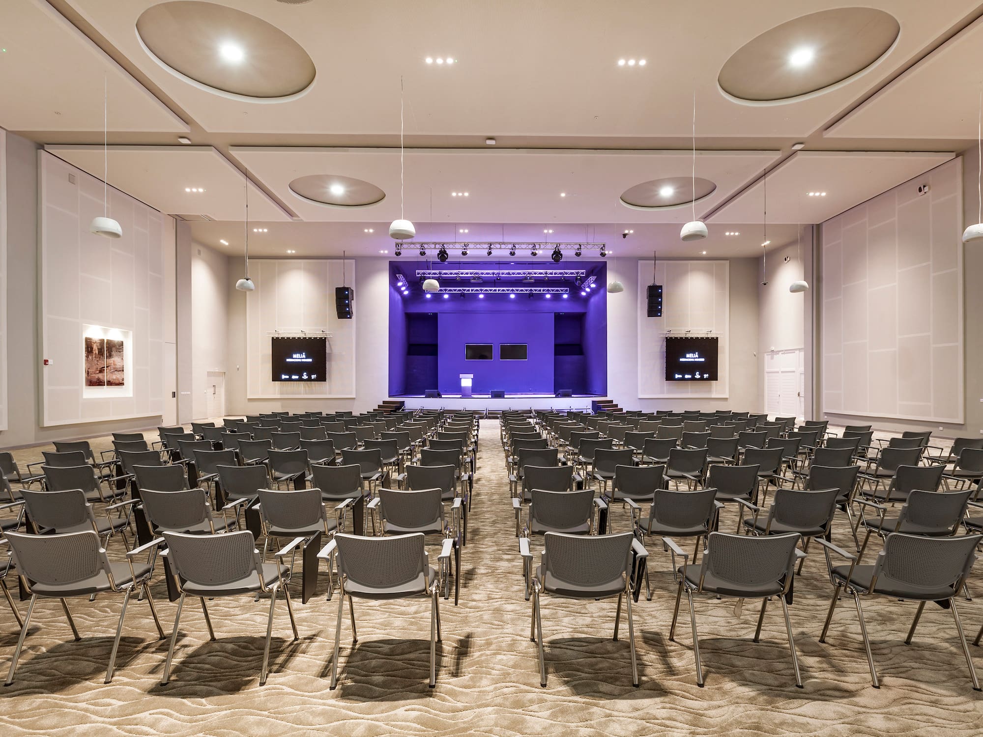 a room with rows of chairs
