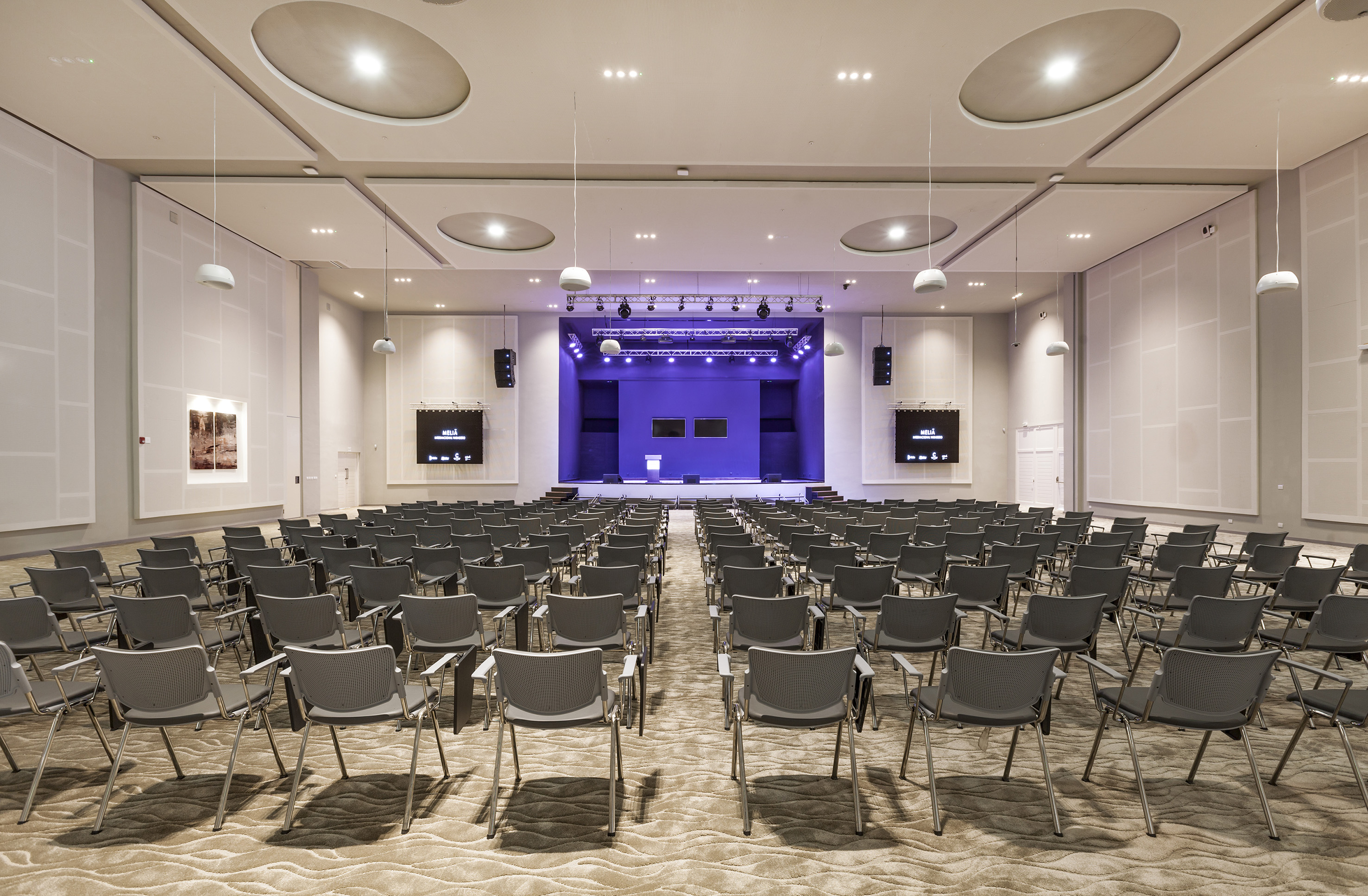 a room with rows of chairs