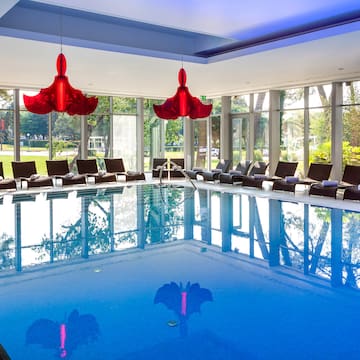 a pool with chairs and a large pool