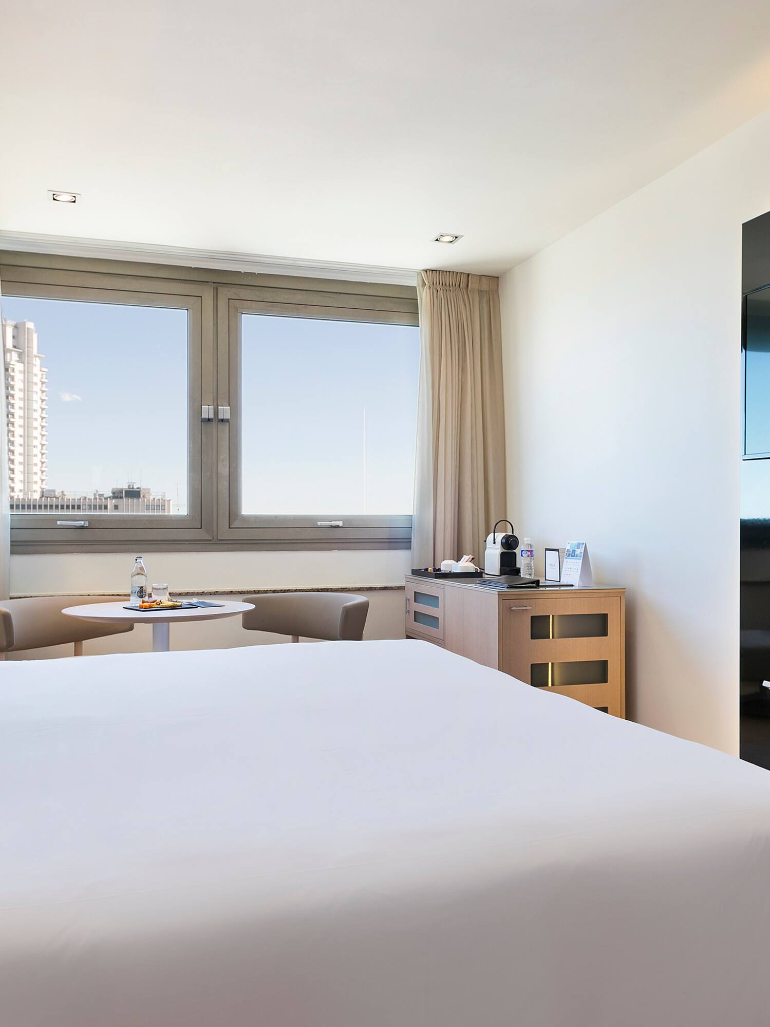 a room with a bed and a tv