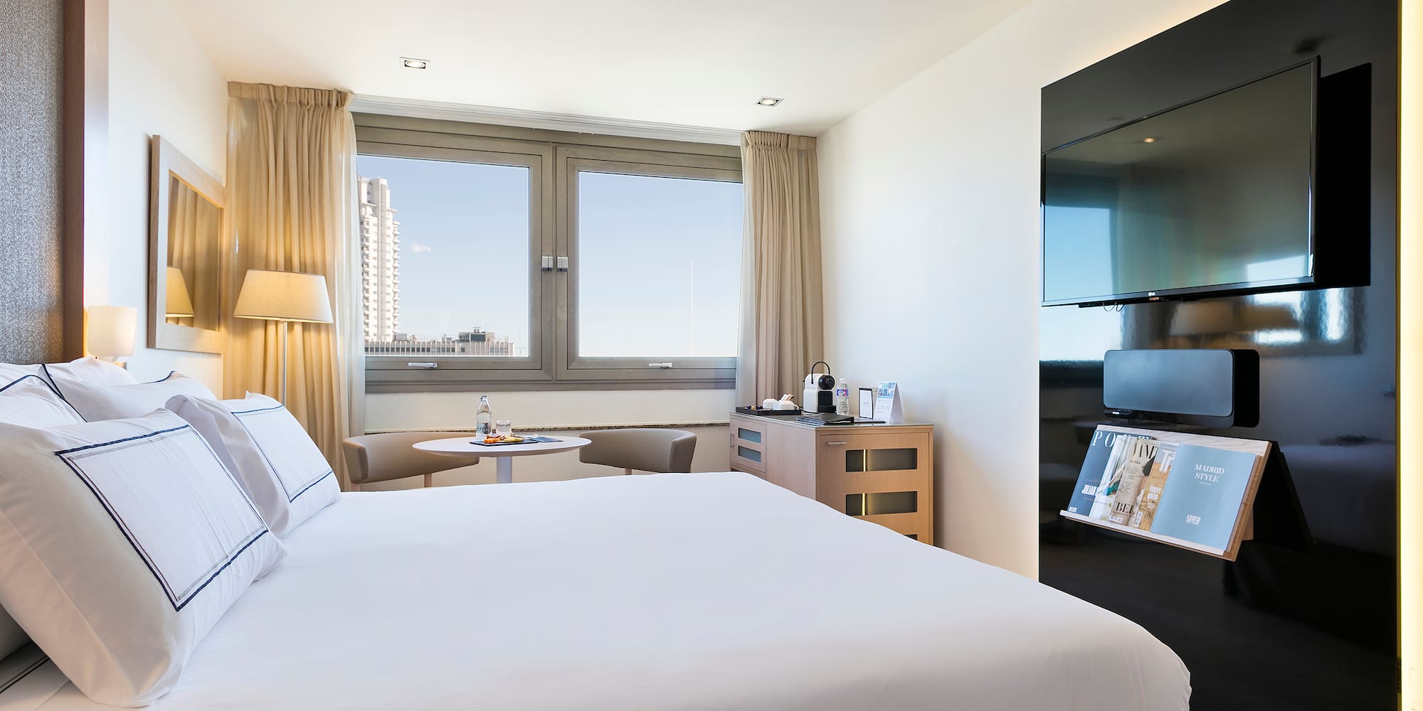 a room with a bed and a tv
