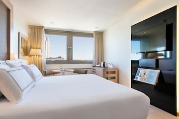 a room with a bed and a tv